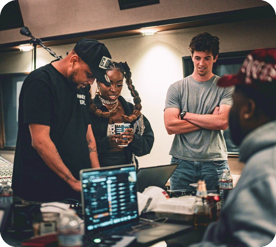 Suno partner managers collaborating with artists in the studio